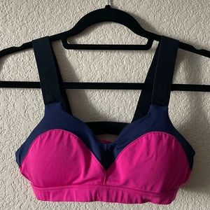 Brooks padded sports bra; magenta w/ navy and black trim; size medium.